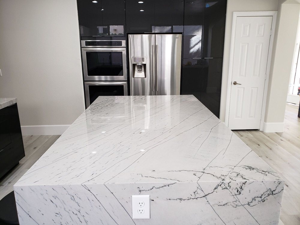 Bookmatched quartzite waterfall island